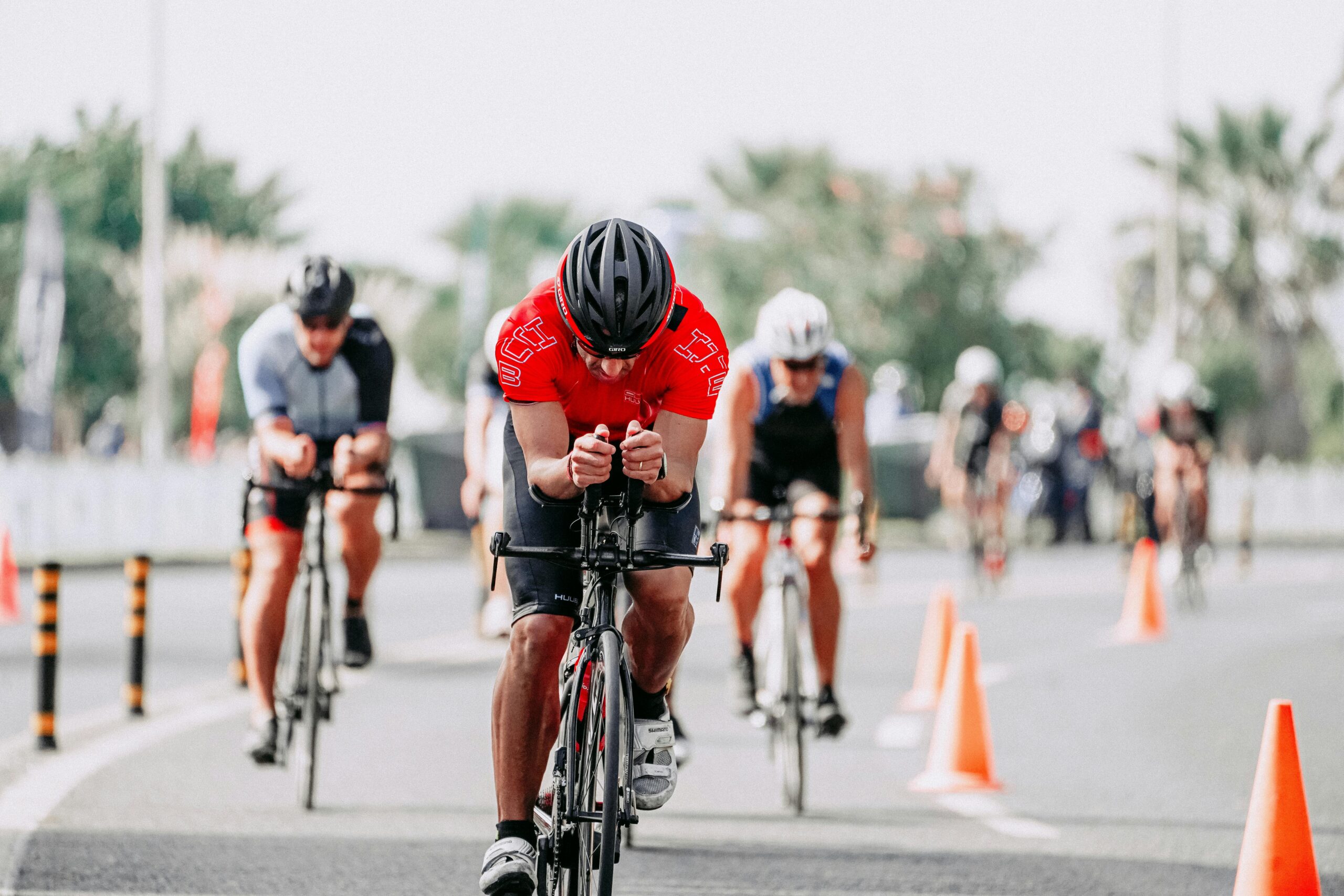 Dynamic shot of cyclists competing in an urban triathlon, showcasing endurance and speed.